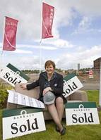 Itâ€™s a sign of the times as Barratt West sales executive, Myra Stevenson checks out the number of homes sold from plan at the Laurels in Rutherglen.