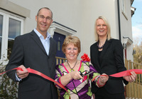 First resident Heather Jewitt with sales director Spencer Drake and Charlotte Lock from Savills.
