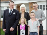 The family outside their new home at Horton Park in Blyth. 