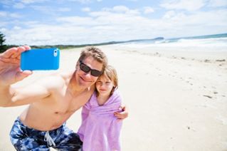Father and daughter on beach