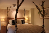 One of Cottage Lodge'#s beautiful hand-made beds