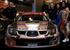 Eugene Donnelly and Paul Kiely with the ex-Petter Solberg Subaru Impreza S12 WRC on the KUMHO stand