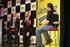 David Brabham and Alan Gow being interviewed on the main stage at the Autosport International Show by compere Henry Hope-Frost