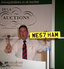 Auctioneer Gary Earle with the WE57 HAM registration plate which sold for Â£57,000 at auction.