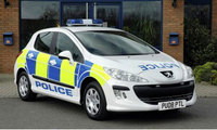 Green Peugeot 308 gets the blue-light treatment