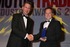 David Wallington from Merritts Jaguar in Amersham picking up the Aftermarket Award from Exxon Mobils UK, Ireland and Benelux Automotive Manager, Adrian Benson, who sponsored the award