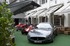 Maserati GranTurismo S, flanked by three of the most stunning single seat grand prix Maseratis of all times - a 250 F, a 6CM and a 4CLT.  