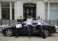 Models pose with Maserati Quattroporte S