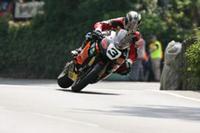 Victorious McGuinness celebrates Honda’s 131st TT win