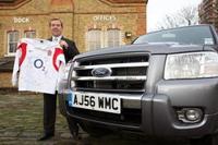 John Oakshott of London Hire shows off his signed England Rugby Shirt besides the New Ford Ranger.
