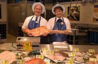 Female fishmongers fillet as well
