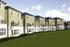An external photo of The Camarthen overlooking the luxurious green