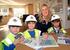 Harlington Lower School Year 1 pupils with George Wimpey Sales Executive Claire Inskip at George Wimpeyâ€™s Parklands development at Woburn Sands.
