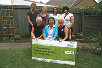 Barratt presents cheque to Watford New Hope Trust