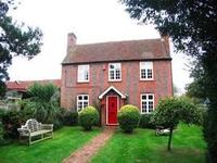Gabled 18th century farmhouse with storybook rustic charm