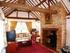 The propertys spacious 23ft triple aspect living room has impressive vaulted ceiling, exposed beams and open fireplace