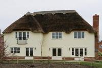 Developer showcases three homes with traditional style