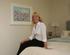 Redrowâ€™s Angie Cotterell, inside the show home with one of her paintings.