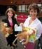 Julie Rayner, left, hands over donations and a cheque for over Â£600 to Helen Knowles