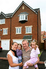 Erica and Neil Barker in front of their new Lowestoft townhouse with their three year old daughter Erin and niece Lily.