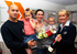 Richard Ward, his wife Louise and children Millie and Leo get a champagne and flowers welcome from The Spires sales negotiator, Deborah Land.