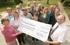 George Cronin presents a cheque to staff from Headway, including Mary Beverley, Ginny Mallick and Hazel Carden.