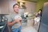 Father and son relax in the kitchen