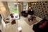 The lounge/dining area of the Fairwood home, showing the impressive garden.