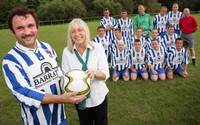 Barratt Homes sales negotiator Hilary Cridge with the Penygraig football team Barratt Homes sales negotiator Hilary Cridge with the Penygraig football team