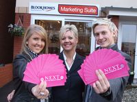 Sophie Pugh and Jamie price with their vouchers, pictured with Bloor Homes Jo Smith (centre)