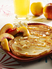 Fluffy vanilla pancakes with sliced white South African nectarines and honey drizzle 