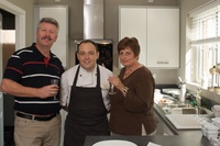 Colin and June Phillips with James Sommerin, in the kitchen of a Redrow show home at Croesonnen Court.