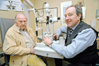 Mr Powell and optometrist David Bull Mr Powell and optometrist David Bull