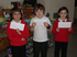 The three winning pupils with their prizes from Taylor Wimpey