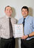Paul Sweet (R), Miller Homes contracts manager, presents Steve Cooper (L) with his award. 