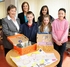 Christine McLaren (left) and Sarah Humphries with youngsters including winner Kealey Thornley (right)