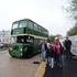Guests start to arrive on a vintage double decker bus.