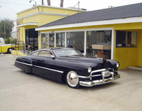 Cars, stars and guitars at 2010 Festival of Speed