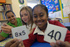 Year 6 pupils Danielle Grubb and Mahmooda Begum with The Tipton’s Dalbeer Dhinsa