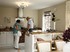 Visitors to Heritage Gardens test out the soft closing kitchen drawers.