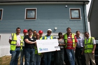 Shower firm get its hands dirty for housing charity