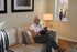 Alison Holland relaxing in her new two-bedroom apartment at Wentworth Place