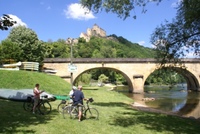 Cyclists by the river