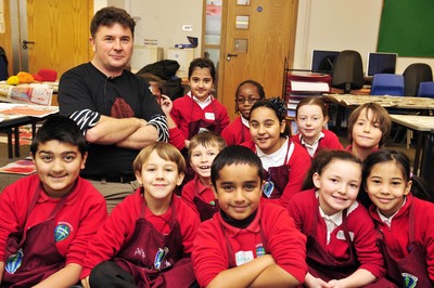 Artist Reece Ingram with pupils from Highworth County Combined School 