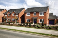 A street scene of new Redrow homes at Priory Fields.