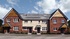 A street scene of new Redrow homes in Moston.