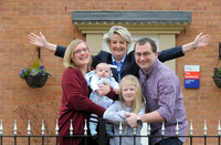 The Jenkins family with Taylor Wimpey Sales Executive Sue Florence at Caldecott Manor in Rugby.