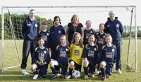 Young footballers cheered on by estate agent sponsors