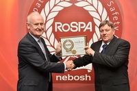 Terry Wragg (right), Contracts Manager for Peveril Homes, collects the Gold Medal award
