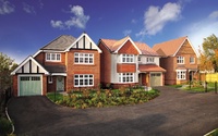 A street scene of traditional looking Redrow homes, similar to those available at Old Gate Park, Penwortham.